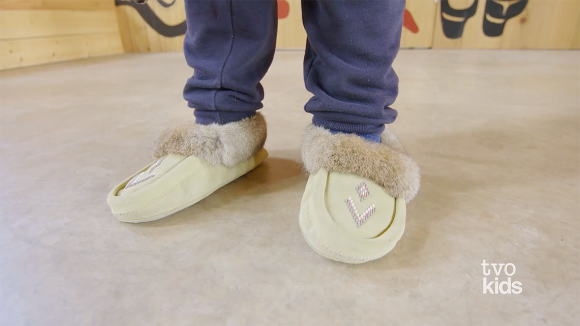 This is a close-up of Drakon wearing moccasins.