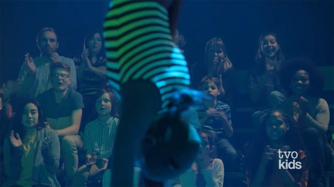Audience members cheering for the performer.