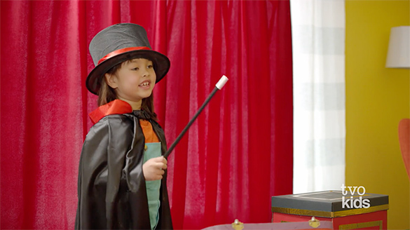 Dee Dee waves a magic wand.