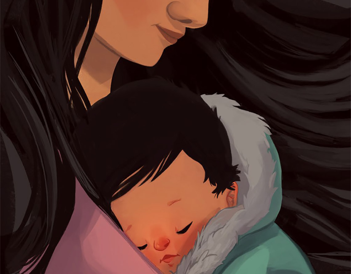A baby sleeps while being held by an adult.