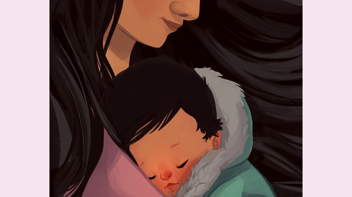 A baby sleeps while being held by an adult.