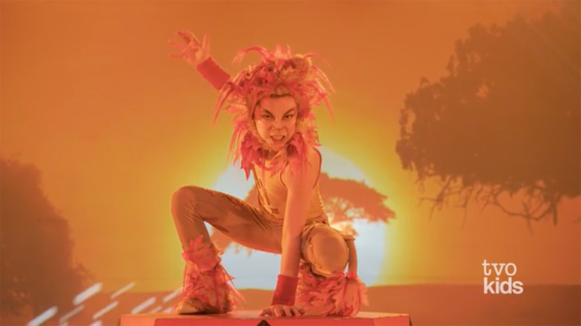 Screenshot from a video with a child dressed as a lion.