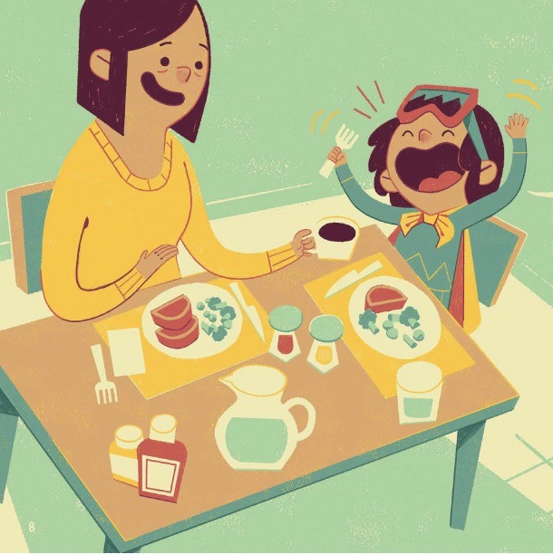 A little girl and an adult eat a meal at a table. The girl is very excited.
