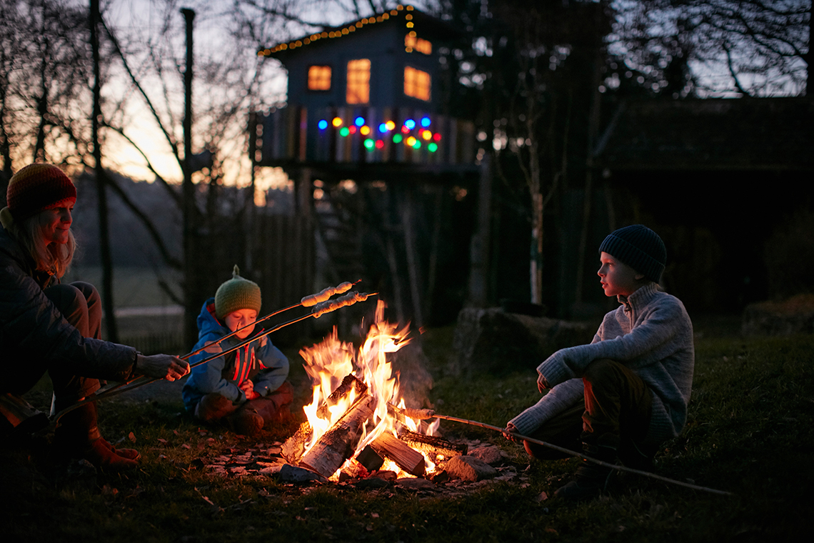 People telling stories around a campfire.