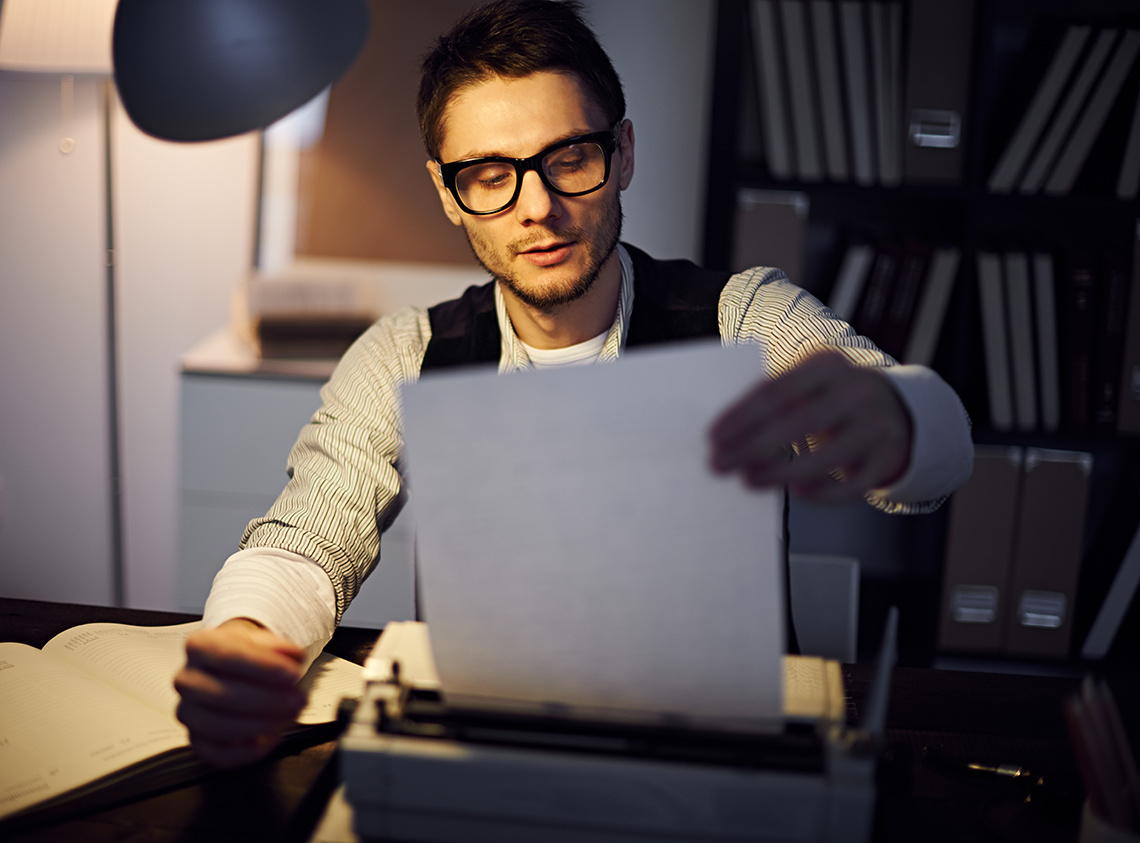 A person examining a script they have written.