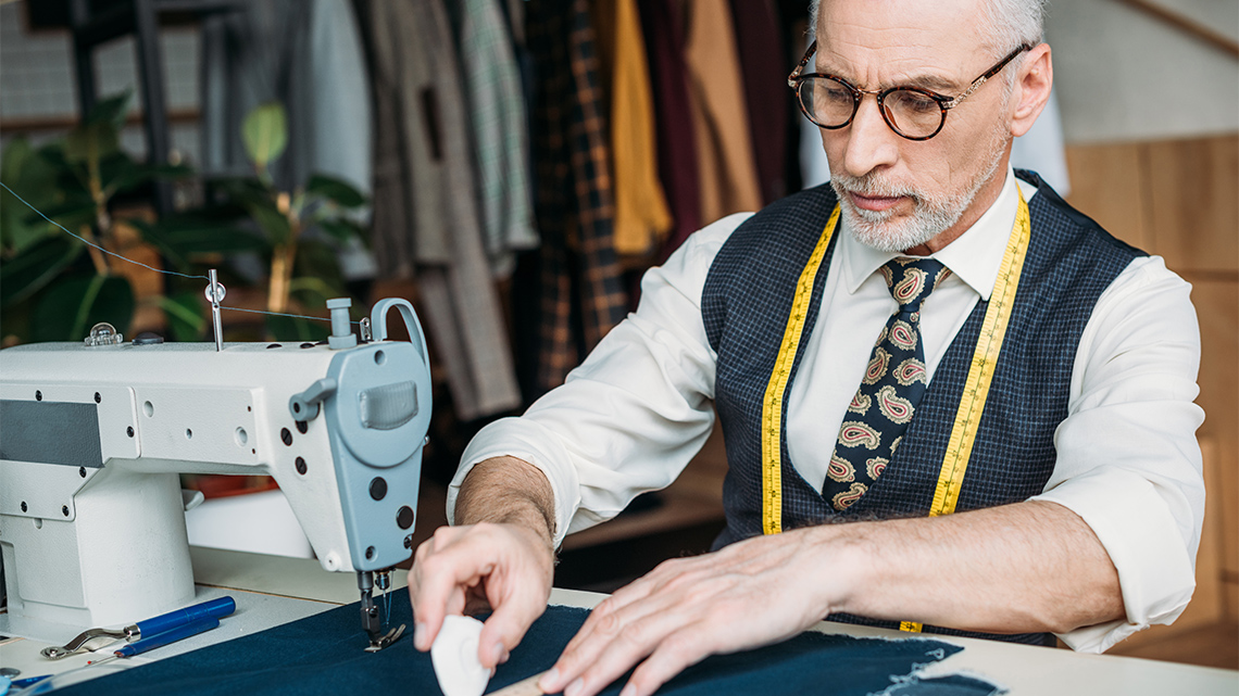 A person using a sewing machine to create costumes