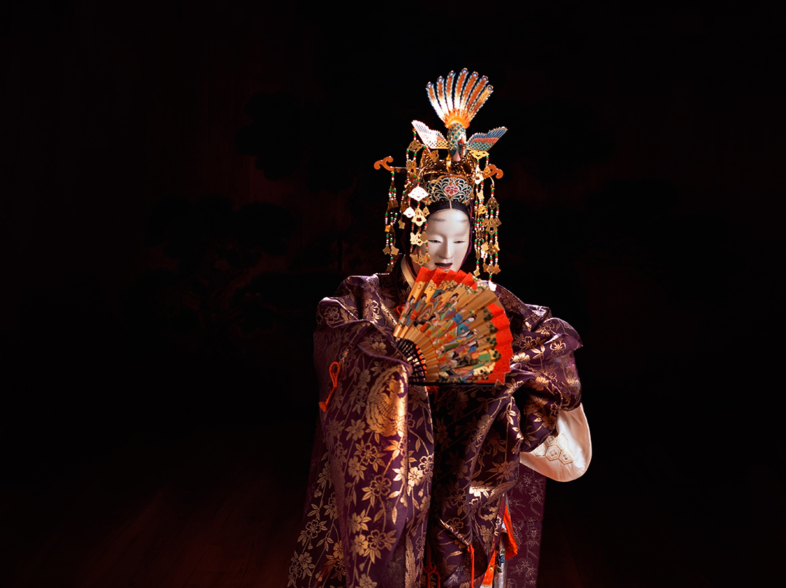 A performer of Noh theatre. This performer is expressing happiness after getting her cloth back.
