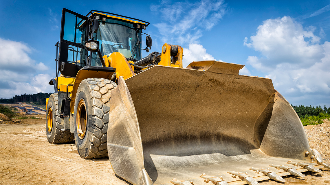 A big bulldozer at a construction site.