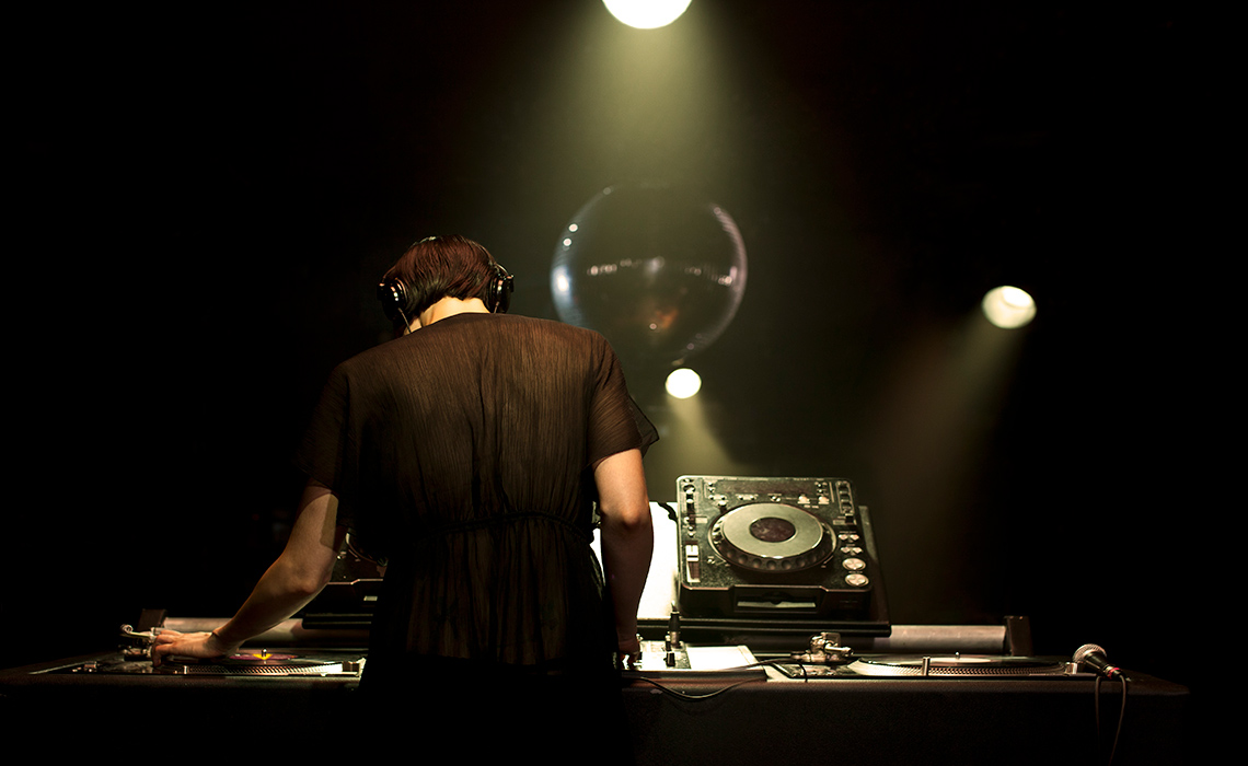 A DJ photographed from behind