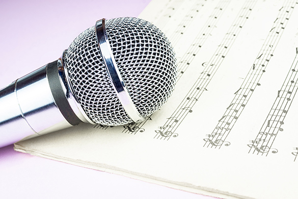 A microphone over sheets of music