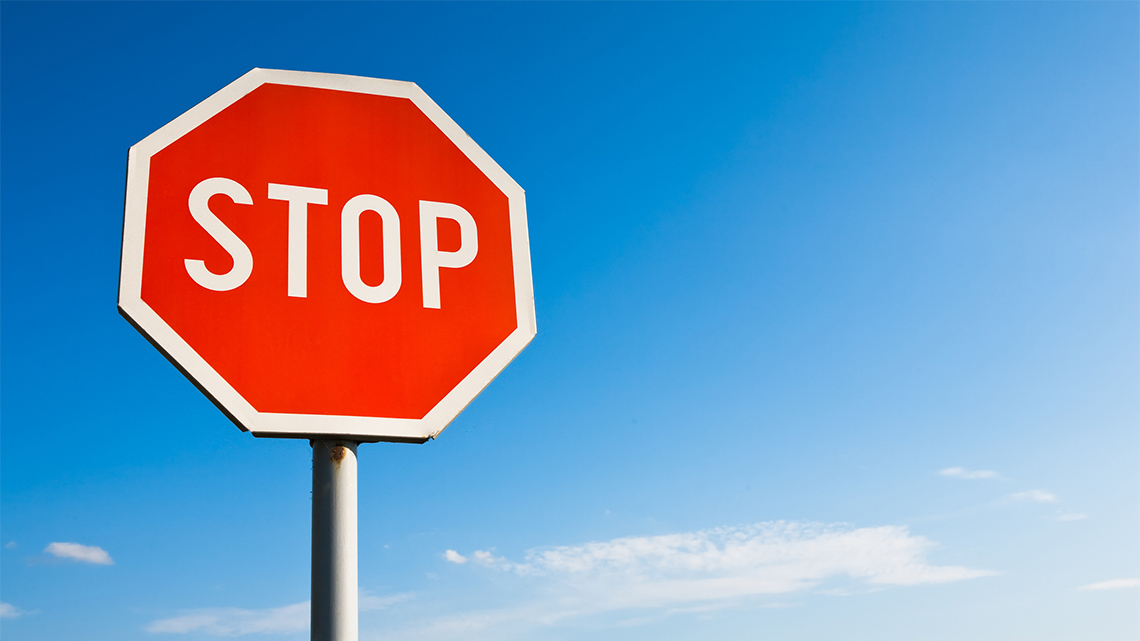 A red octagon with white edges and the word STOP in the centre