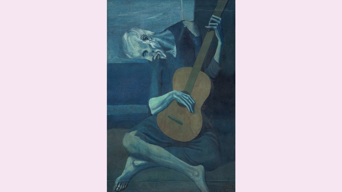 A painting that uses mostly blue colours of a guitar player sitting cross-legged looking down with a serious expression