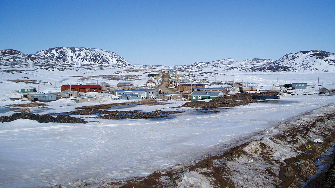 A snowy landscape with a small town.