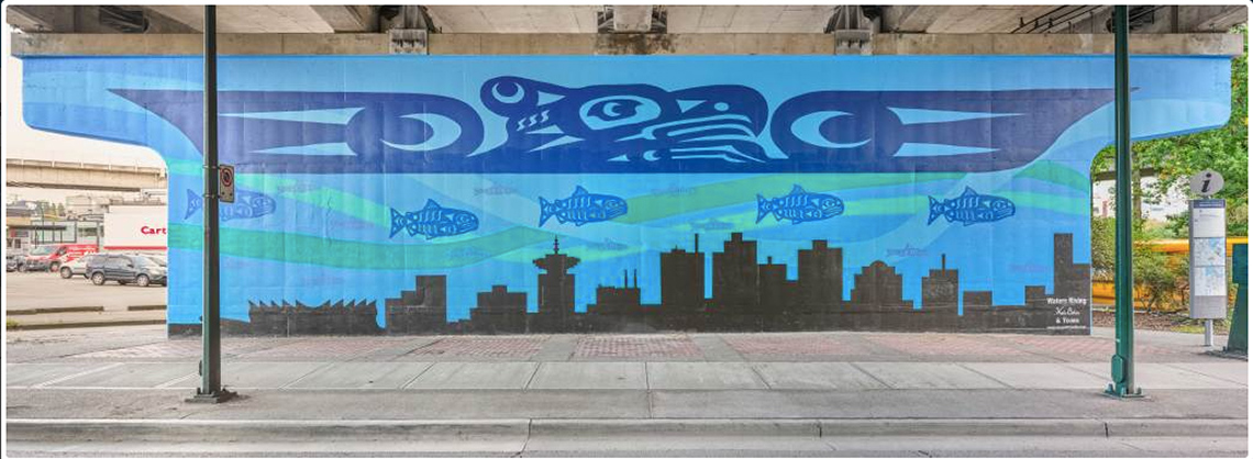 A mural of a city skyline being covered by water and fish, while a thunderbird hovers over the city.