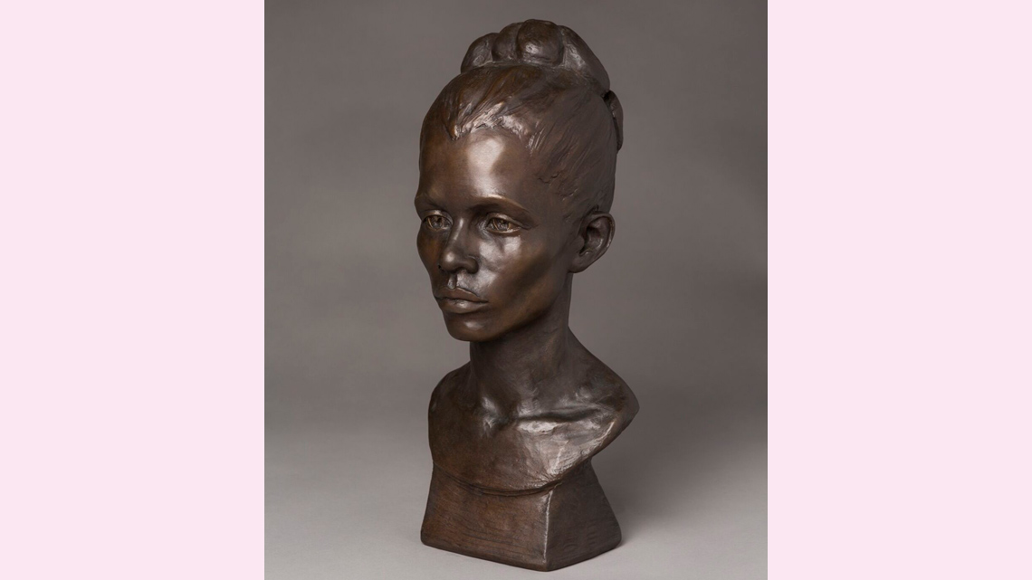 A three-dimensional sculpture. It consists of the model’s head and neck only.