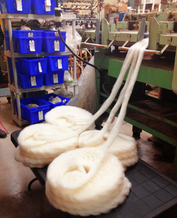 A machine carding the wool and making it into long pieces so that it is easy to spin.