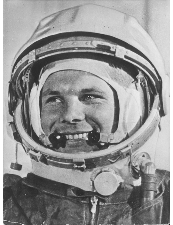 White male astronaut Yuri Gagarin wearing his helmet and flight suit.