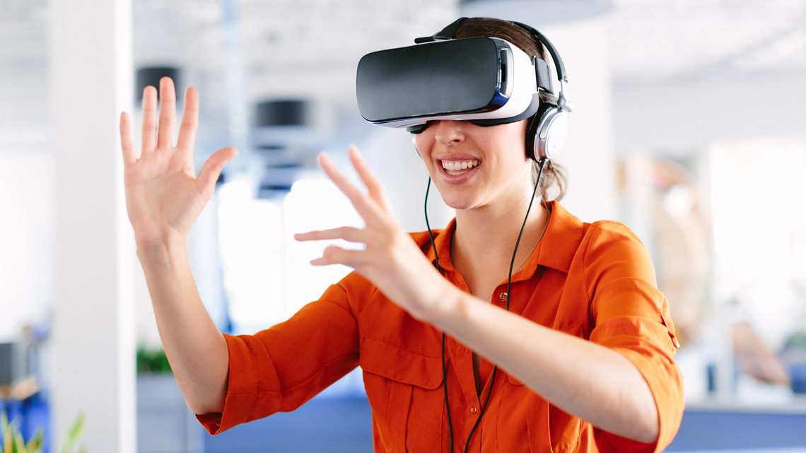 Individual wearing a VR (visual reality) headset covering their eyes.