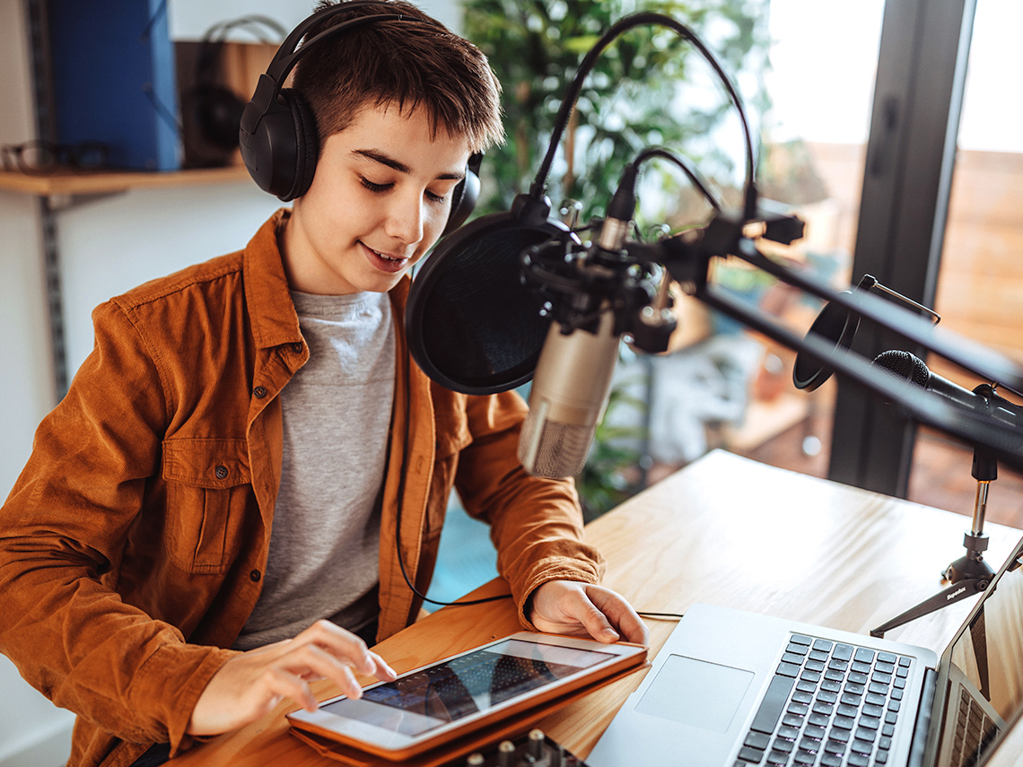 A woman recording a podcast.
