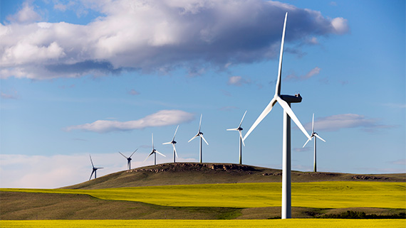 A landscape featuring many wind turbines.