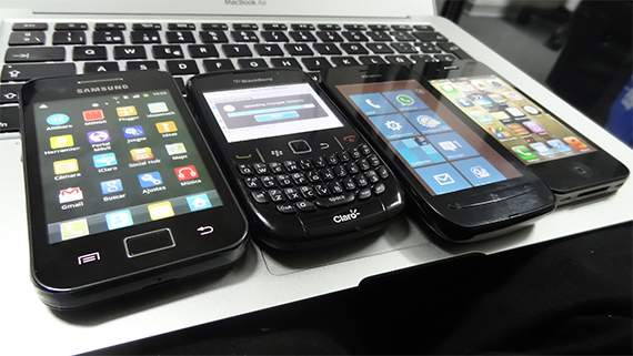 Four different smart phones beside one another.