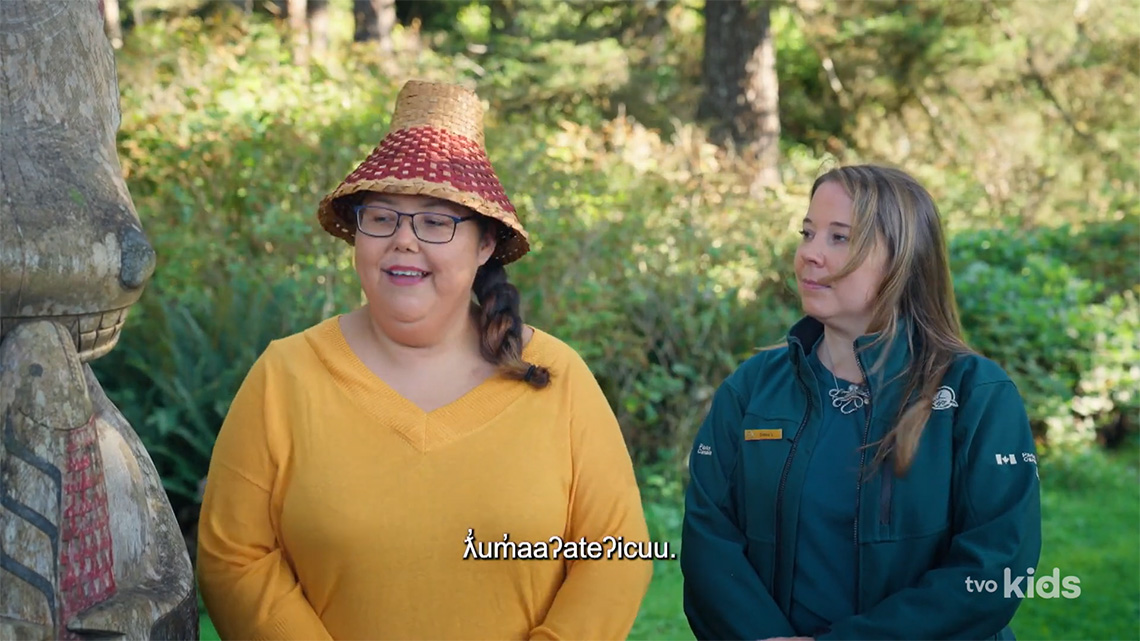 Jeneva standing beside Diana. Jeneva welcomes everyone in Nuu-chah-nulth.