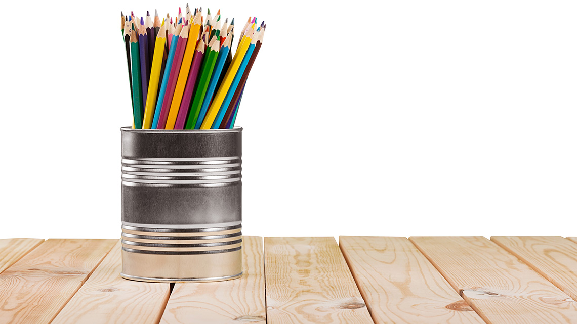 A can used as a pencil crayon holder.
