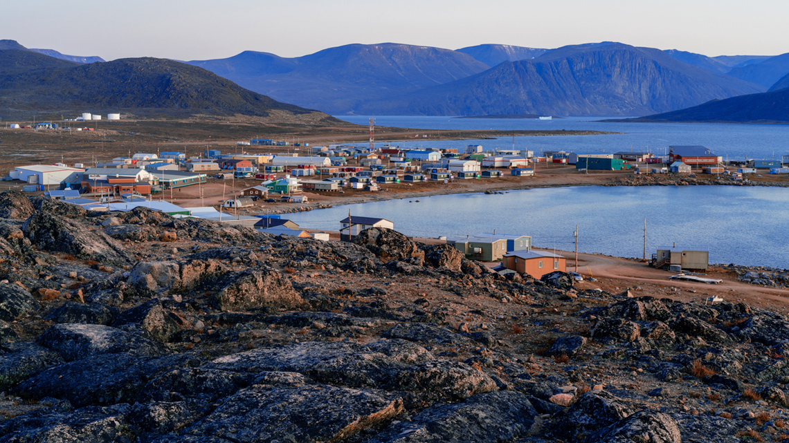 Artic landscape with bare hills and ocean overlooking the Inuit settlement of Qikiqtarjuaq Broughton Island, Nunavut.