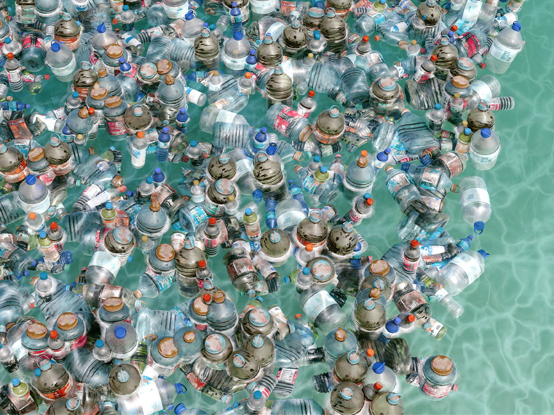 A mass of discarded plastic bottles in the ocean