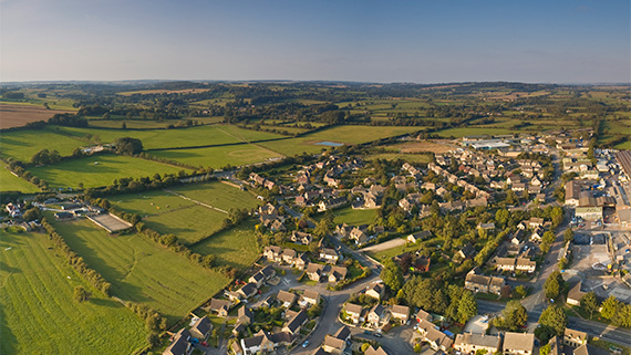 A housing development on the edge of farm land.