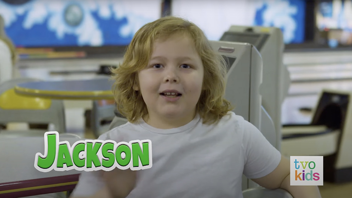 Jackson says hello and waves their hand very fast.