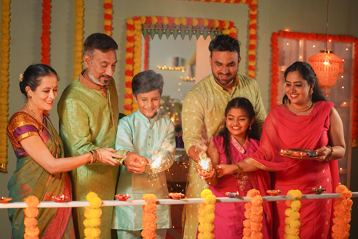 Family members enjoying Diwali celebrations at home.