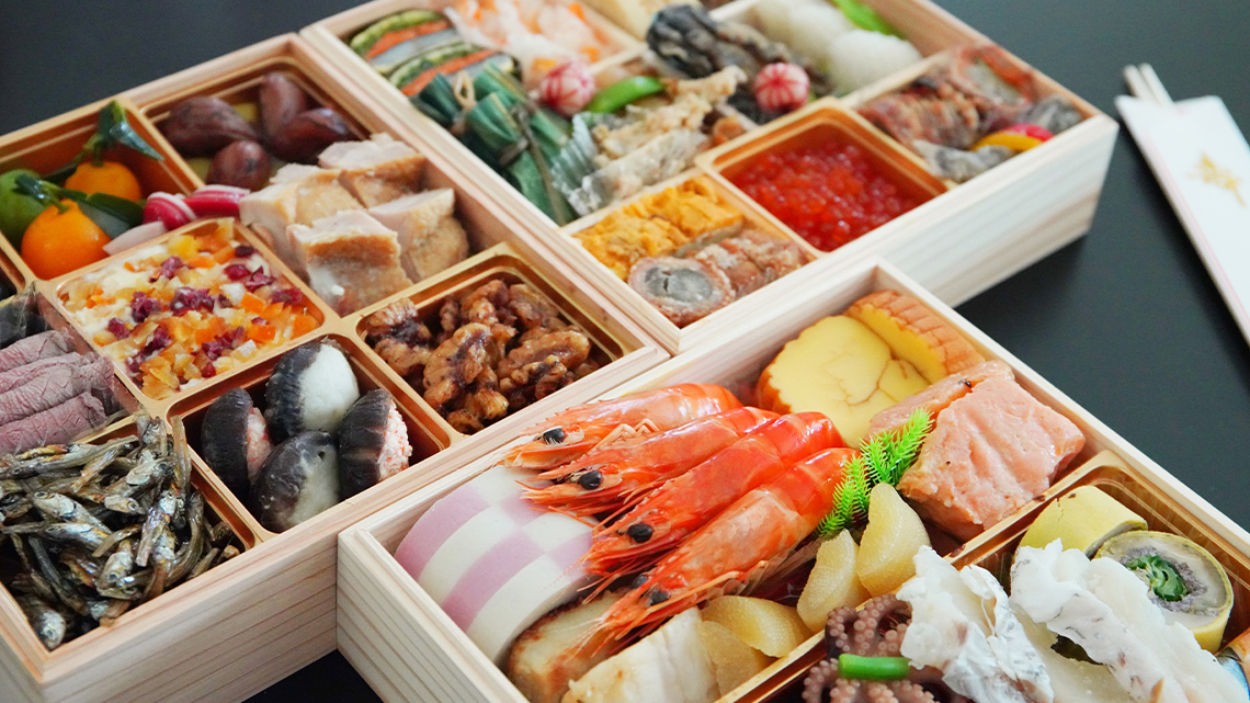 Two boxes with many kinds of different food. Each type of food is carefully packed into a smaller box inside the two boxes.