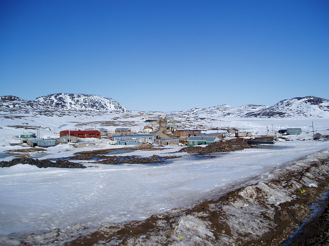 A snowy landscape with a small town.