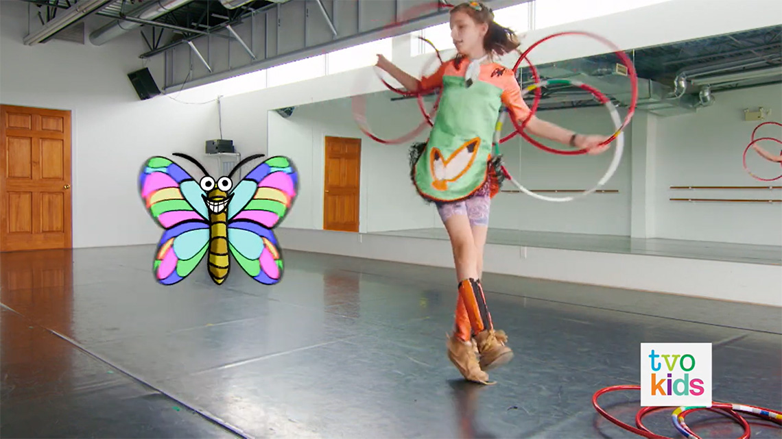 Emily shows how hoops on her arms and back can help her make a butterfly shape.