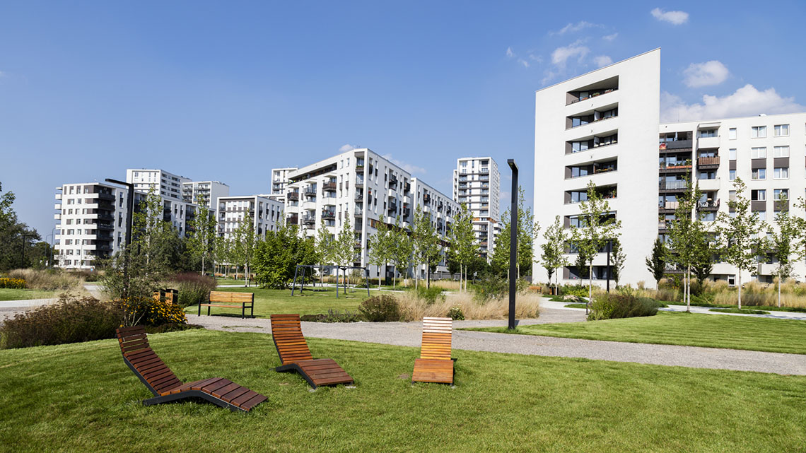 Tall apartment buildings have many floors for people to live on.