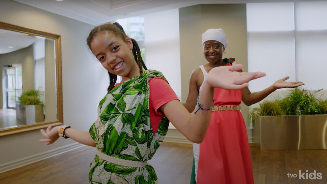 Nicole learning Burundian dance with her teacher.