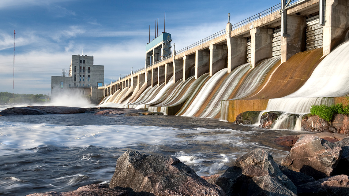 A hydroelectricity plant with a large dam controlling water flow, in Manitoba.