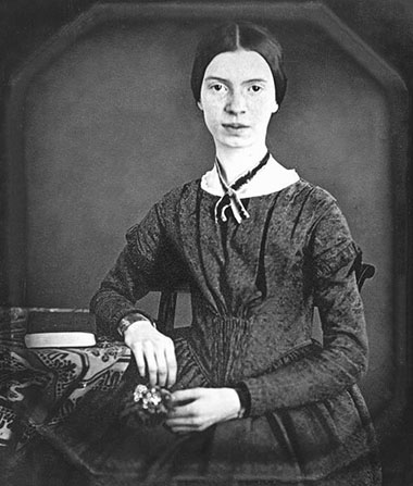 A black and white photograph of Emily Dickinson