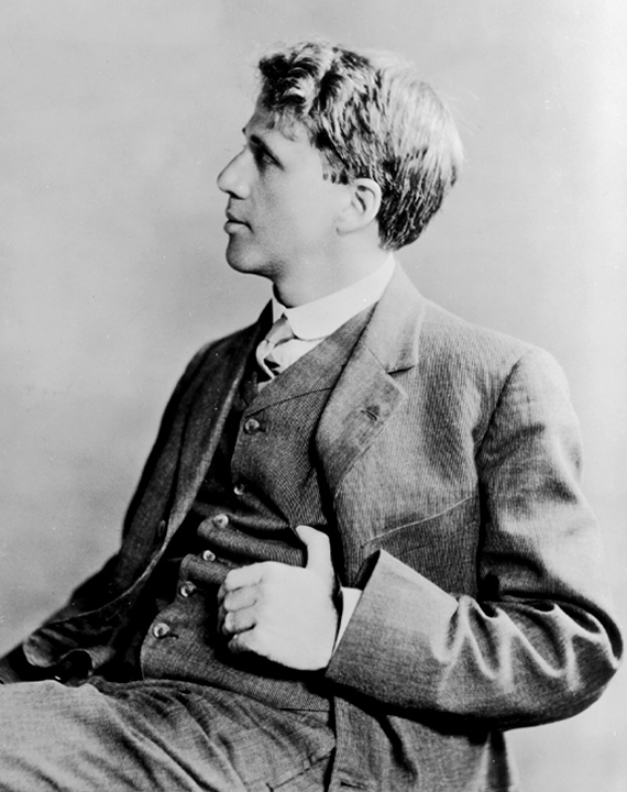 A black and white photograph of Robert Frost