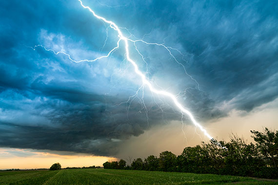 Lightning from a storm cloud striking the ground