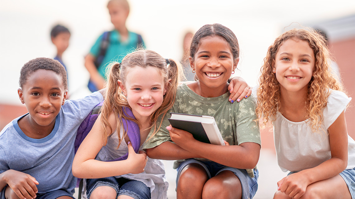 A group of friends hanging out together at school.