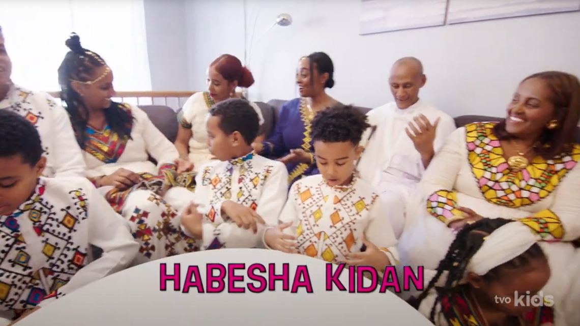 Boys wearing habesha kidan and women wearing zuria.