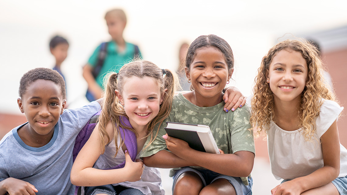 A group of friends hanging out together at school.