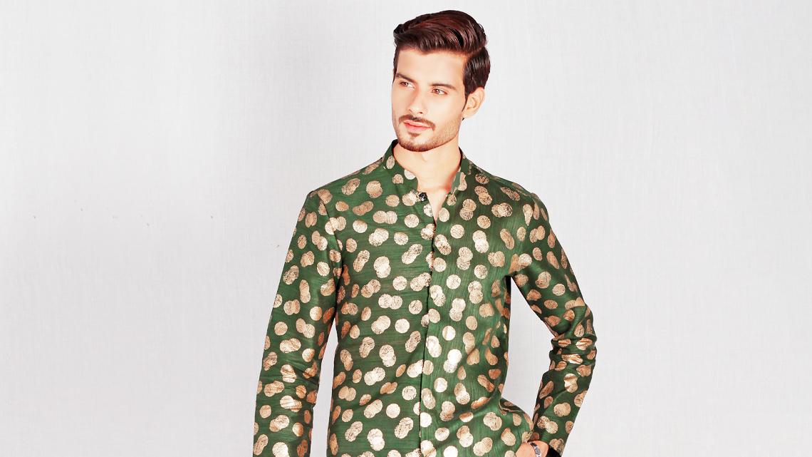 A person wearing a button-up kurta tunic with a collar and long sleeves.