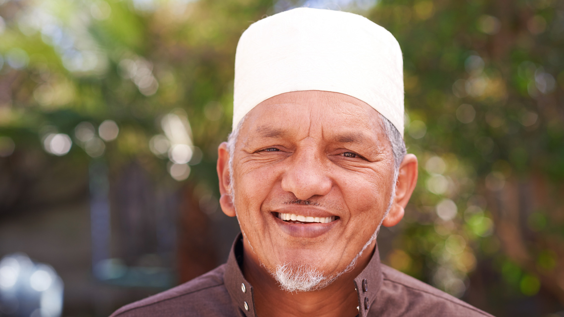 A tall cap without a brim is called a topi.