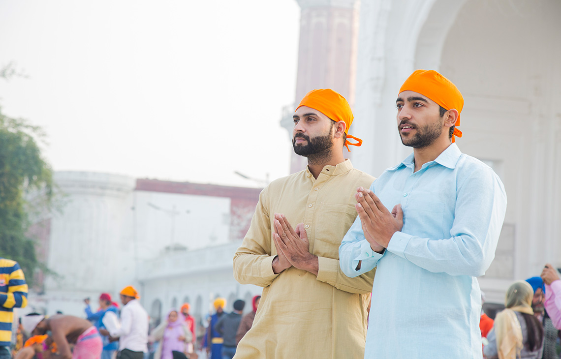 Two men praying together