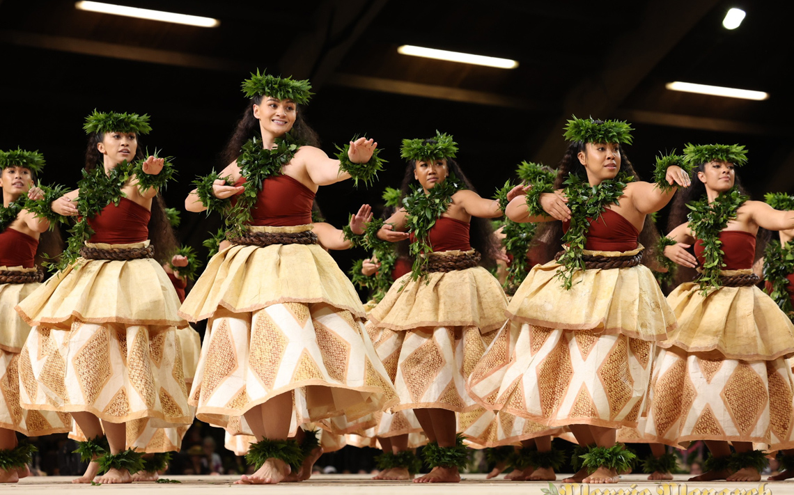 Hula kahiko dancers from Hālau o Kekuhi on stage at the Merrie Monarch Festival.