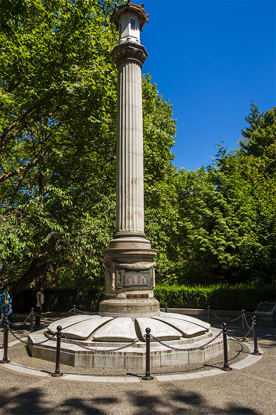 A pillar-like memorial in a park setting.