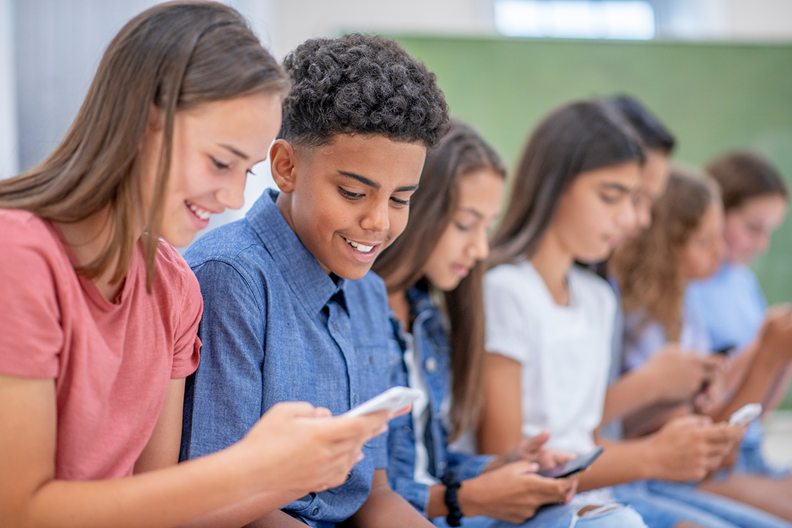 A group of learners using smartphones